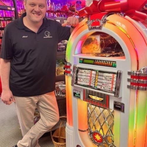 Michael Speach '02 filled a jukebox with hit records from his collection, and set it up in The Speach Family Candy Shoppe. Customers can play songs for a quarter, with the money going to local organizations.