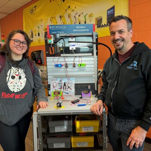 Bella Gutkin is in her first semester in OCC's new Electromechanical Technology certificate program. She's pictured with Applied Technology Professor Mike Grieb (right) in the Robotics Lab in the Whitney Applied Technology Center.