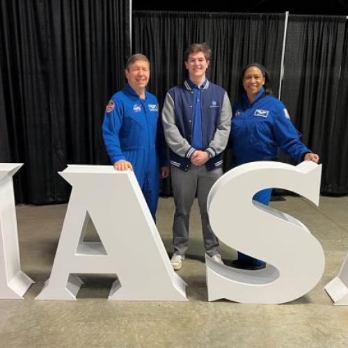 Onondaga Community College Alumnus Isaac Bennett '24 (center) is pictured at NASA with astronauts Dr. Michael Barratt (left) and Jeanette Epps (right) who is a graduate of Syracuse's Corcoran High School.