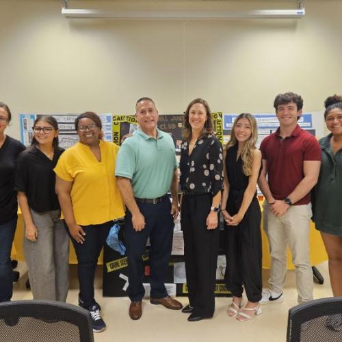 Students in the Criminal Justice Club welcomed Esteban Gonzalez (center left) and Julie Corn (center right) of Onondaga County's 911 Center to campus for their first meeting of the year.