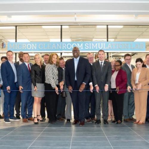 A wire cutting ceremony was held outside the Micron Cleanroom Simulation Lab on the second floor of the Whitney Applied Technology Center.