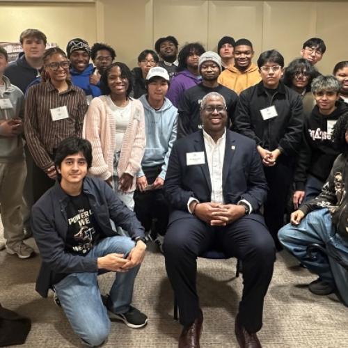 Onondaga Community College President Dr. Warren Hilton (seated) is pictured with students who participated in the first Pre-College Semiconductor Summer Program. 