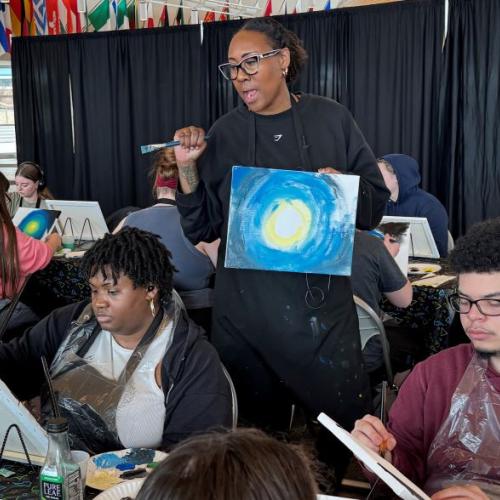 Nikki Hendrix shares her story with students during her painting therapy workshop in the Gordon Student Center.