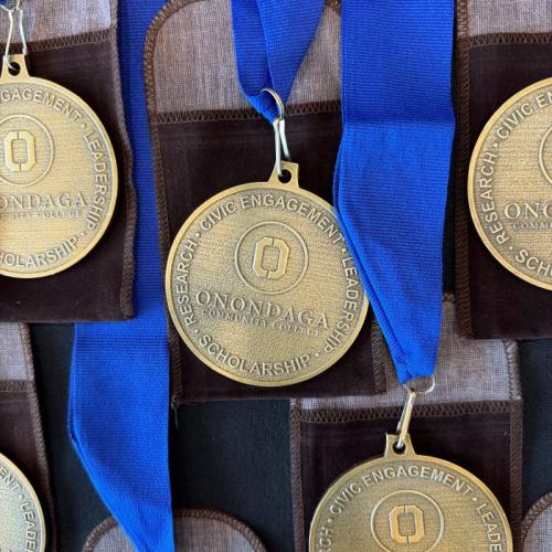 Onondaga Community College Pinnacle Awards recipients were honored with these medals which they will wear at commencement May 16.