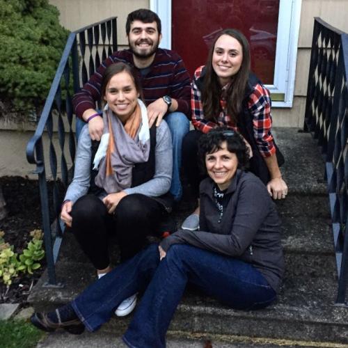 Dee DiCocco (seated on bottom step) is pictured with her three children who all earned degrees at Onondaga Community College - Maria (seated next to her), Jeff, and Carly (next to Jeff).