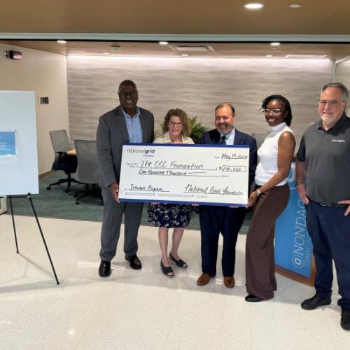 The National Grid Foundation's check presentation to Onondaga Community College included (left to right) OCC's Warren Hilton, Louis Noce, and Terry Hopkins, and National Grid's Kahri Fuller and Alberto Bianchetti.