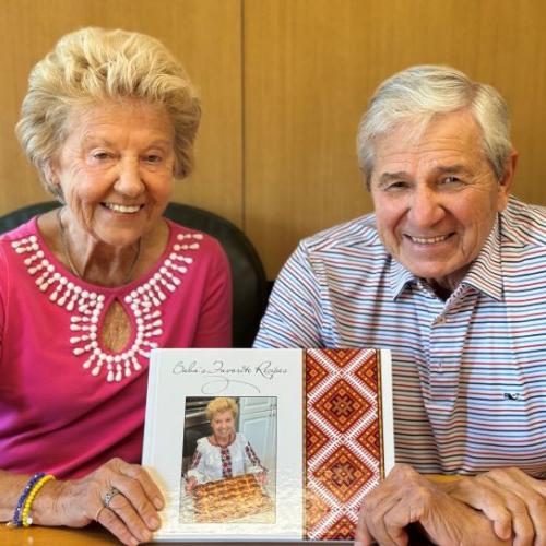 Alumna Halyna Lisnyczyk '65 (left) and her husband and Professor Emeritus Victor Lisnyczyk (right) are pictures with their cookbook, which has raised more than $45,000 for an orphanage in Ukraine.