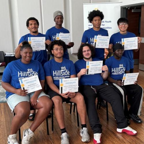 The first group of Syracuse City School District students to graduate from the Bridge to Manufacturing Learning Community program proudly pose for a group photo.