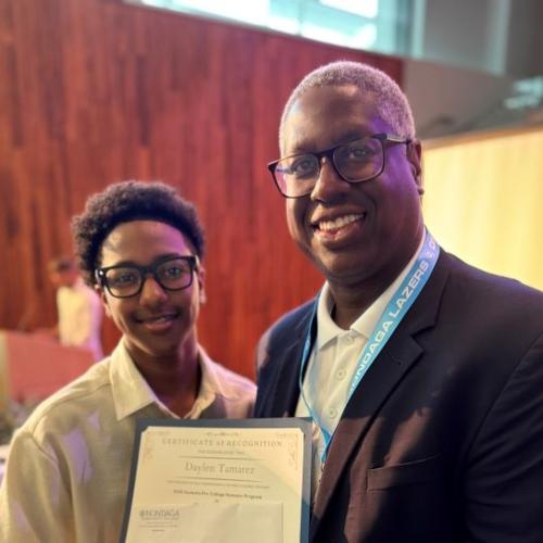 Daylen Tamarez (left) is congratulated by Onondaga Community College President Dr. Warren Hilton for completing the Sankofa Pre-College Summer Program. Tamarez came to OCC from New York City where he will be a high school junior this fall.