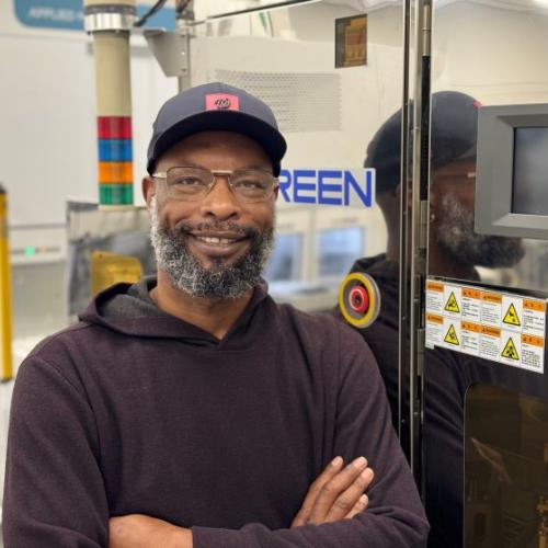 Greg Anderson is a 45-year-old student at Onondaga Community College who will complete his Electrical Technology degree this December, then go to work at Micron Technology in Virginia. He's pictured in the Micron Cleanroom Simulation Lab on the OCC campus.