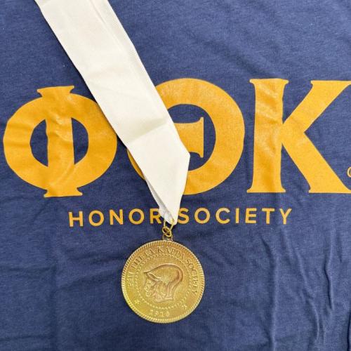 Phi Theta Kappa shirt and medallion