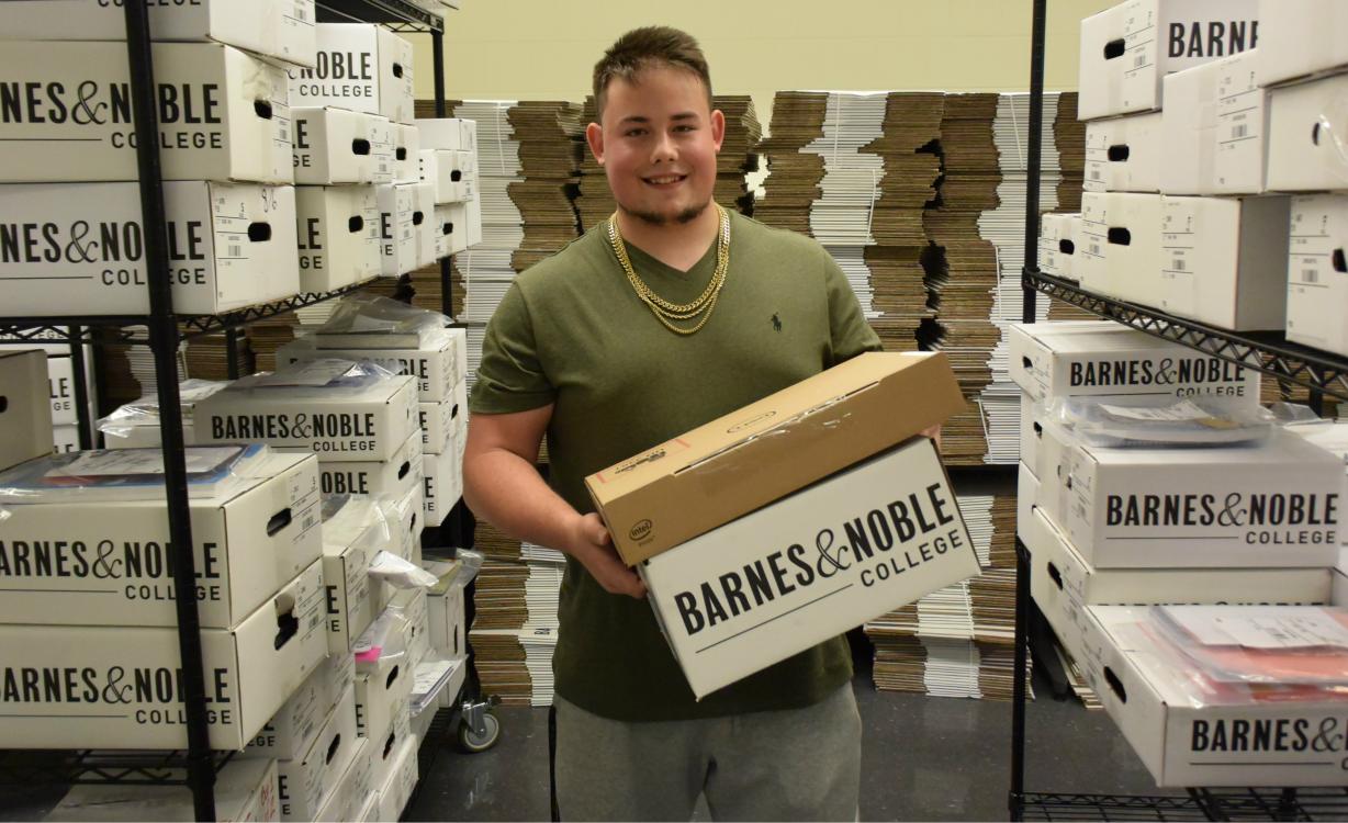 Tyler Czyz picks up his Box of Books and Chromebook in the Whitney Applied Technology Center. Tyler Czyz picks up his Box of Books and Chromebook in the Whitney Applied Technology Center.