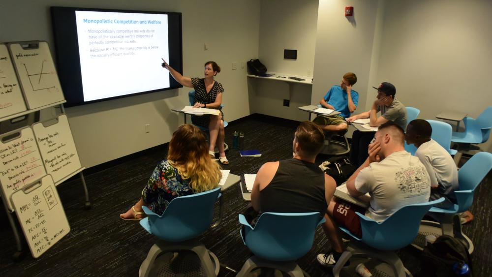 Professor Kristen Costello leads students through her summer Microeconomics class in Whitney Commons. Professor Kristen Costello leads students through her summer Microeconomics class in Whitney Commons.
