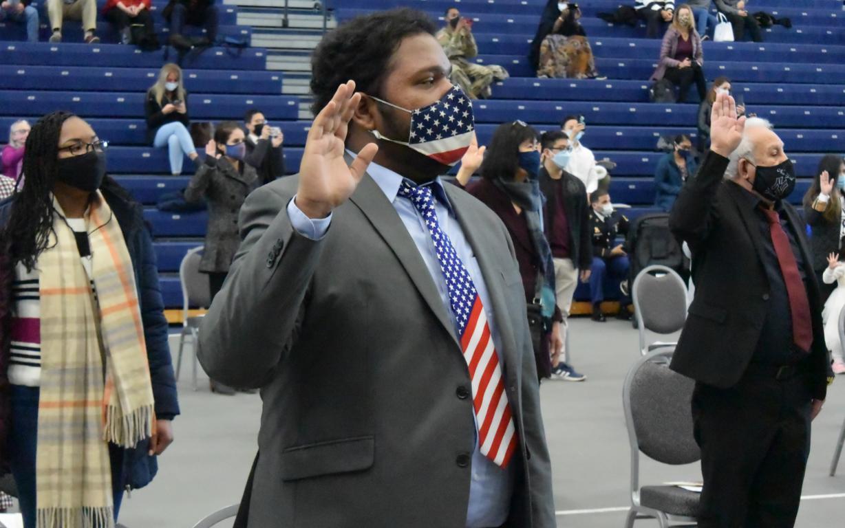 Joshua Bonila was one of 50 new American citizens sworn-in during a ceremony in the SRC Arena November 17. He's a native of India who attends Le Moyne College. Joshua Bonila was one of 50 new American citizens sworn-in during a ceremony in the SRC Arena November 17. He's a native of India who attends Le Moyne College.