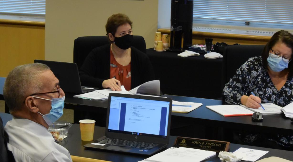 Student Trustee Catherine Hadden (center) participates in the November Board of Trustees meeting. Also pictured are (left) Board Chair John Sindoni and (right) Assistant to the President Julie Hart.