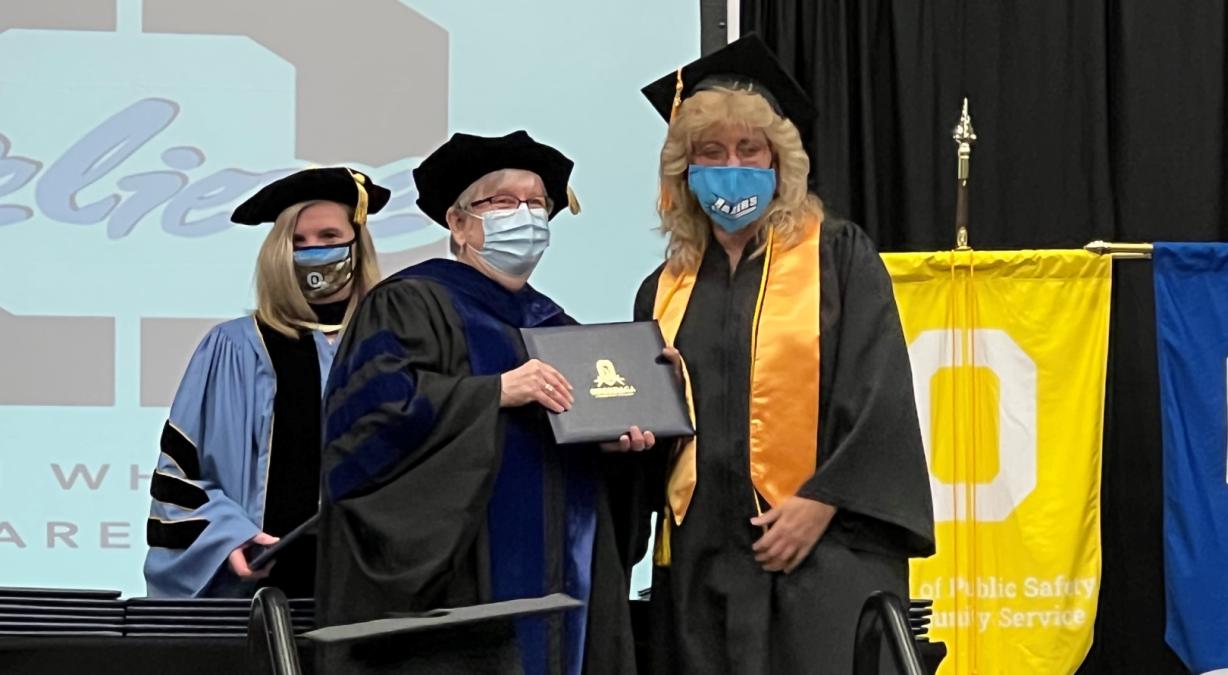 Kim Benton receives her degree Kim Benton receives her degree