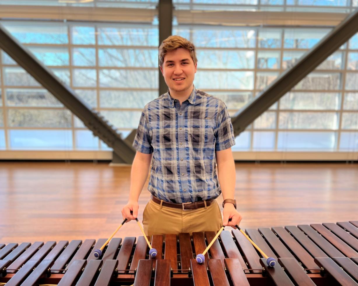 Brandon Phelps is in the Music degree program and an RA in the residence hall. He's pictured playing the marimba in the Academic II building. Brandon Phelps is in the Music degree program and an RA in the residence hall. He's pictured playing the marimba in the Academic II building.