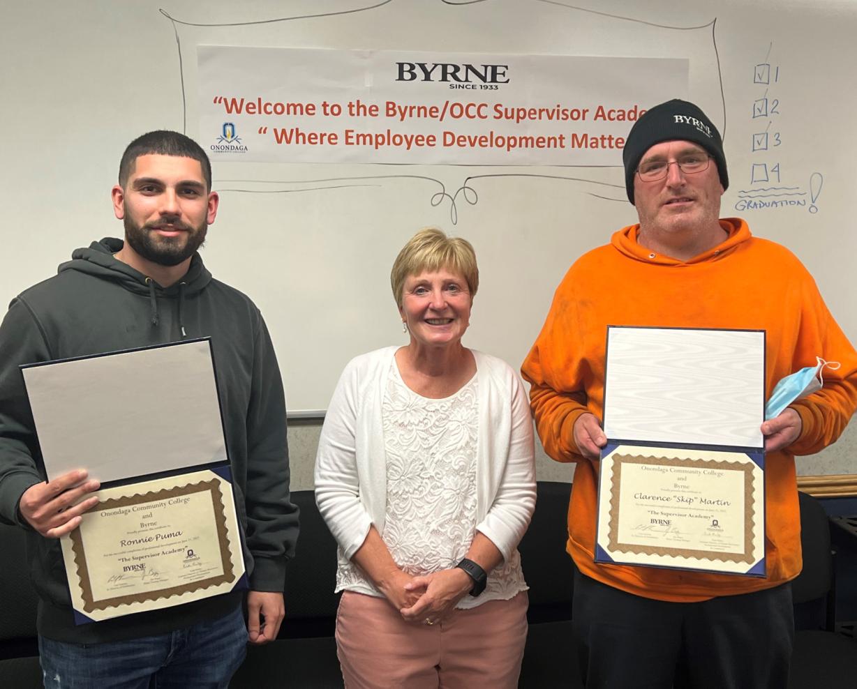 Ronnie Puma (left) and Skip Martin (right) are the first Byrne Dairy employees to complete the Supervisor Academy. They are pictured with OCC's Enid Reiley (center).