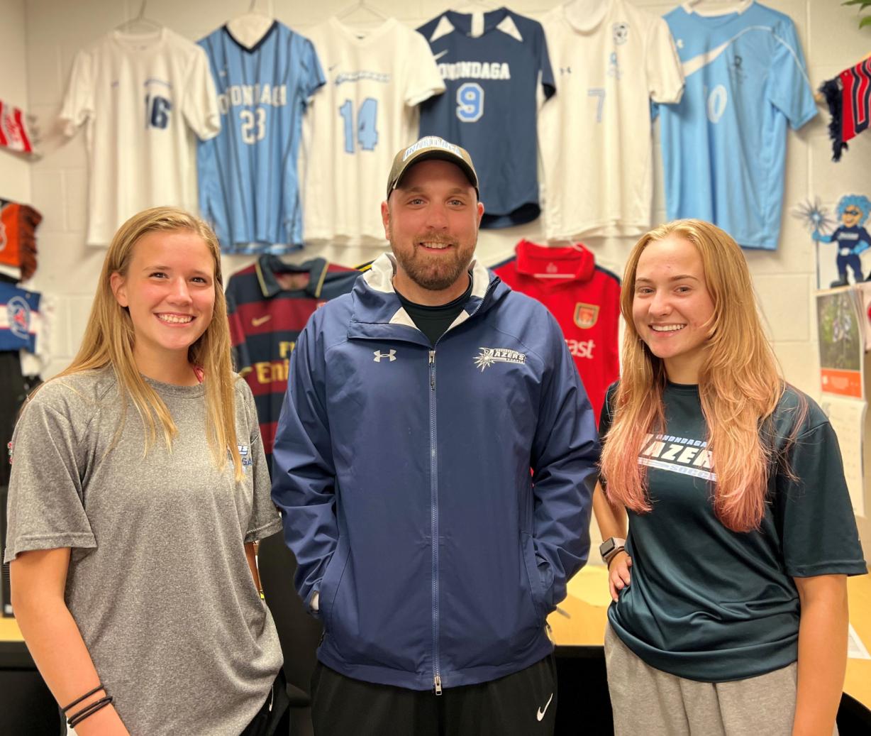 Women's Soccer Head Coach Sean St. Dennis (center) is pictured with two of his top players, Madison Pelton (left) and Lynnae Russell (right).