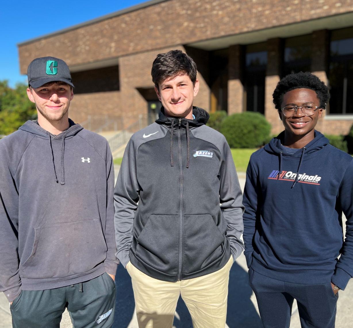 Men's Soccer Head Coach Mike Drake (center) and players Jack Hopson (left) and Thomas Nimineh (right) are pictured on campus. They joined us recently for an edition of our podcast, "Chatting About College." Men's Soccer Head Coach Mike Drake (center) and players Jack Hopson (left) and Thomas Nimineh (right) are pictured on campus. They joined us recently for an edition of our podcast, "Chatting About College."