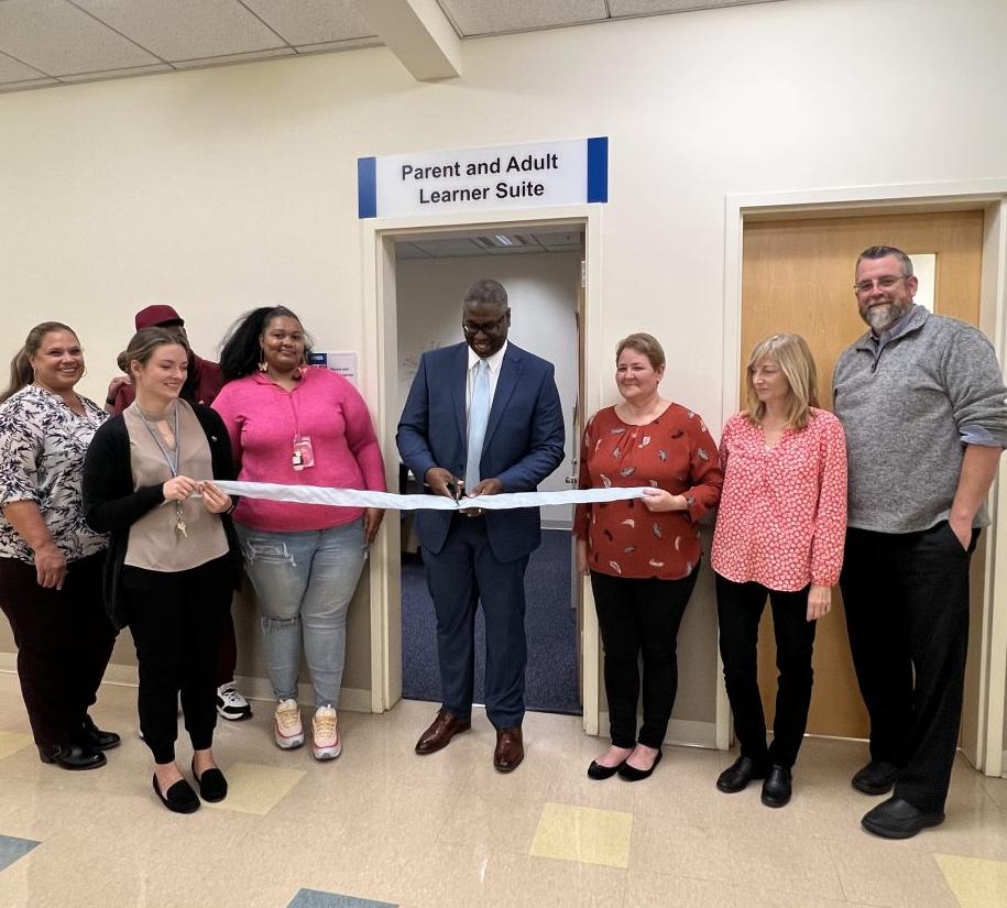 OCC President Dr. Warren Hilton (center) cuts the ribbon on the new Parent and Adult Learner Suite in Mawhinney Hall. OCC President Dr. Warren Hilton (center) cuts the ribbon on the new Parent and Adult Learner Suite in Mawhinney Hall.