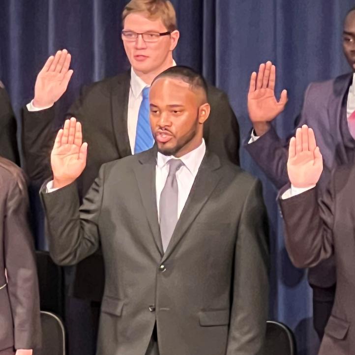 DeJuan Tigner Jr. (front row, center) was sworn-in as a Syracuse Police Officer during a ceremony in Storer Auditorium. Tigner is a 2022 graduate of OCC's Criminal Justice degree program. DeJuan Tigner Jr. (front row, center) was sworn-in as a Syracuse Police Officer during a ceremony in Storer Auditorium. Tigner is a 2022 graduate of OCC's Criminal Justice degree program.