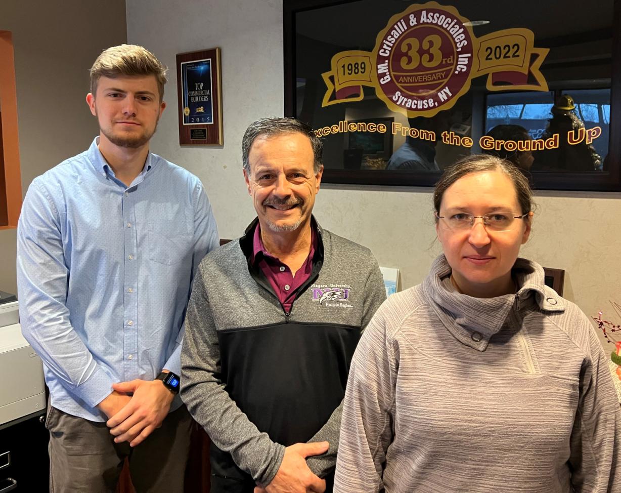 Rocco Paone '76 (center) has been a leader at Crisalli Construction for 32 years. He's joined there by fellow Onondaga Community College Architectural Technology Alumni Iryna Leskiv '09 and Bogdan Bondarenko '20. Rocco Paone '76 (center) has been a leader at Crisalli Construction for 32 years. He's joined there by fellow Onondaga Community College Architectural Technology Alumni Iryna Leskiv '09 and Bogdan Bondarenko '20.