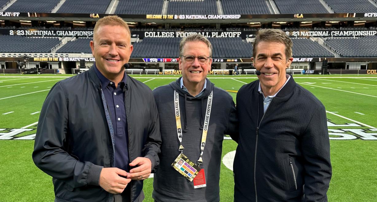 OCC Alum Bill Bonnell '83 (center) is pictured on the field at SoFi Stadium where the College Football Championship game was played. He's standing with broadcast colleagues Kirk Herbstreit (left) and Chris Fowler (right).