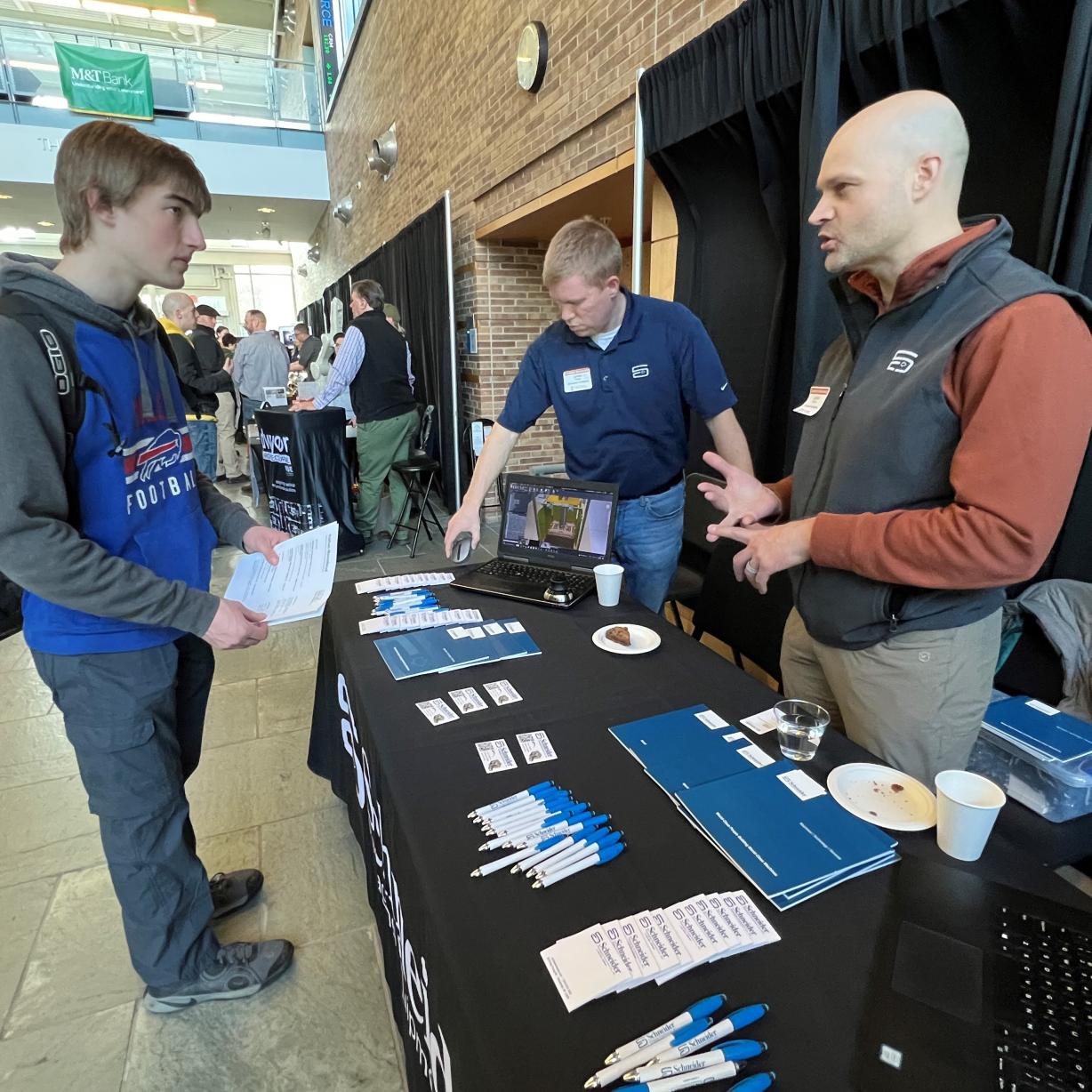 OCC student Nathan Moorehead (left) speaks with Jamie Barber (right) and Will Glass (center) of Schneider Packaging at the Career & Applied Technology Career Showcase. The event was held March 28 in the Whitney Applied Technology Center. OCC student Nathan Moorehead (left) speaks with Jamie Barber (right) and Will Glass (center) of Schneider Packaging at the Career & Applied Technology Career Showcase. The event was held March 28 in the Whitney Applied Technology Center.
