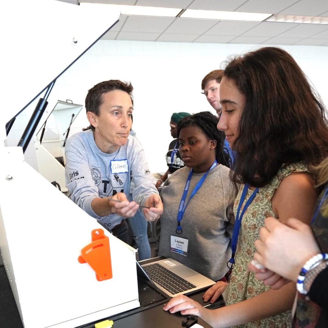 Colleen Stevens (left) works with students during a CNC Machining exercise as part of a Micron-Sponsored "Girls Going Tech" event at Onondaga Community College. Colleen Stevens (left) works with students during a CNC Machining exercise as part of a Micron-Sponsored "Girls Going Tech" event at Onondaga Community College.