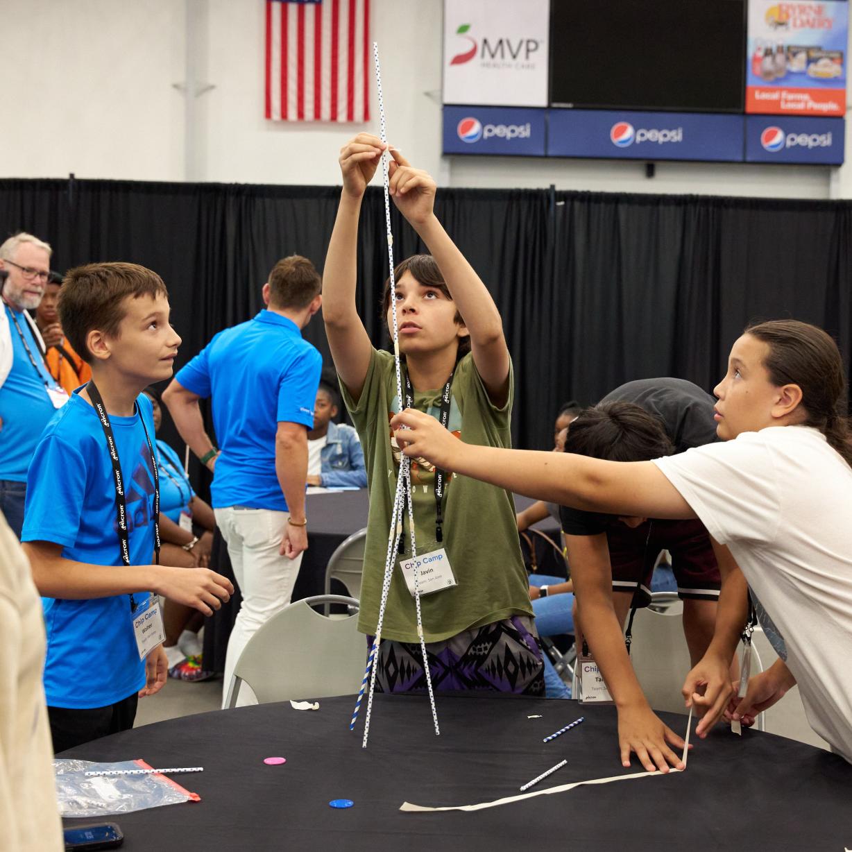 Students work together during the Straw Challenge at Micron-sponsored Chip Camp on the OCC campus.