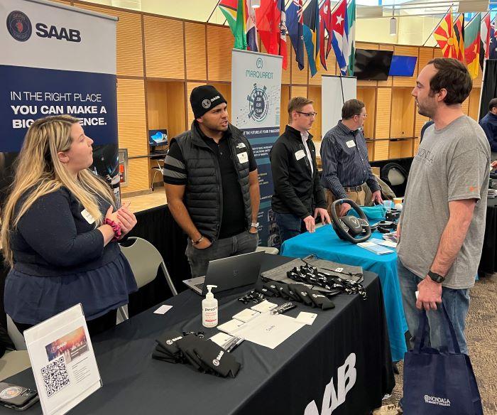 OCC Computer Science major Liam Chavis (right) spoke with representatives of Saab, Inc. at the STEM Showcase in the Gordon Student Center. OCC Computer Science major Liam Chavis (right) spoke with representatives of Saab, Inc. at the STEM Showcase in the Gordon Student Center.