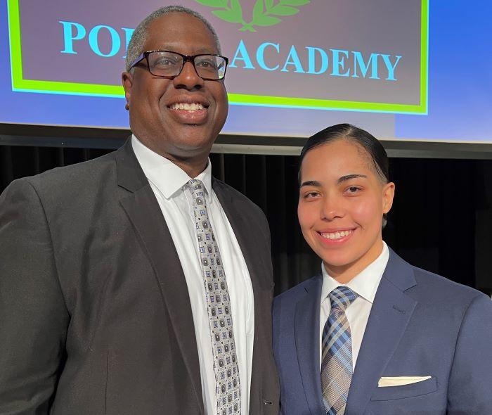 OCC President Dr. Warren Hilton (left) congratulated Nadia Diaz '20 (right) on becoming a new Syracuse Police Officer. She was sworn-in during a ceremony in Storer Auditorium. OCC President Dr. Warren Hilton (left) congratulated Nadia Diaz '20 (right) on becoming a new Syracuse Police Officer. She was sworn-in during a ceremony in Storer Auditorium.