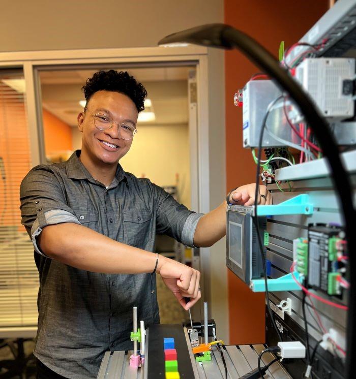 Robert "RJ" Tinsley is in OCC's new Micron-related Electromechanical Technology degree program. He's been selected for a paid internship at Micron in Boise, Idaho. He's pictured in OCC's Electromechanical Lab in the Whitney Applied Technology Center. Robert "RJ" Tinsley is in OCC's new Micron-related Electromechanical Technology degree program. He's been selected for a paid internship at Micron in Boise, Idaho. He's pictured in OCC's Electromechanical Lab in the Whitney Applied Technology Center.