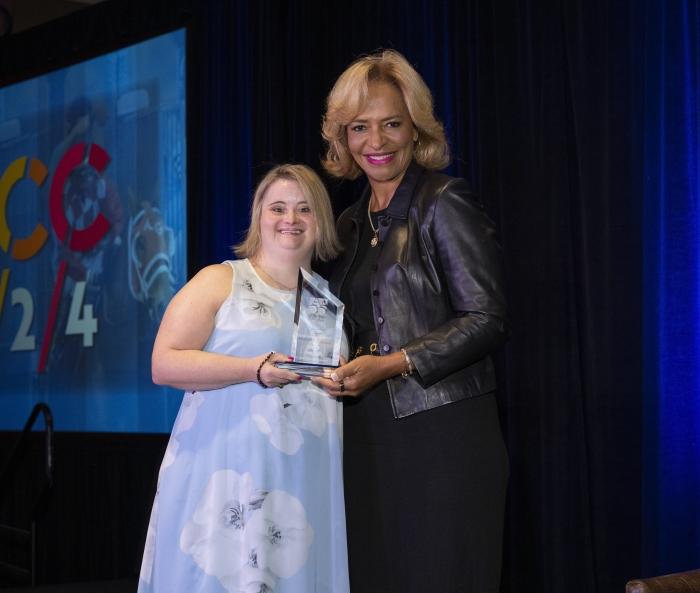 Onondaga Community College graduate Kayla McKeon '22 receives the Outstanding Alumni Award from the Ava Parker, Chair of the American Association of Community College's during its annual gathering earlier this month in Louisville. Onondaga Community College graduate Kayla McKeon '22 receives the Outstanding Alumni Award from the Ava Parker, Chair of the American Association of Community College's during its annual gathering earlier this month in Louisville.