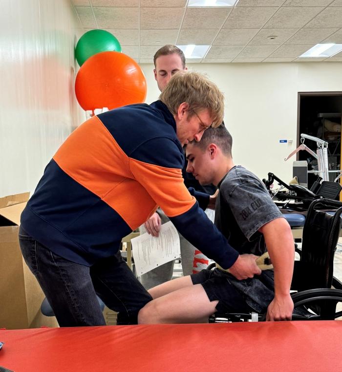 Students in Onondaga Community College's Physical Therapist Assistant program practice the challenging skill of transferring a patient out of a wheelchair in the Physical Therapy lab in Ferrante Hall. Students in Onondaga Community College's Physical Therapist Assistant program practice the challenging skill of transferring a patient out of a wheelchair in the Physical Therapy lab in Ferrante Hall.