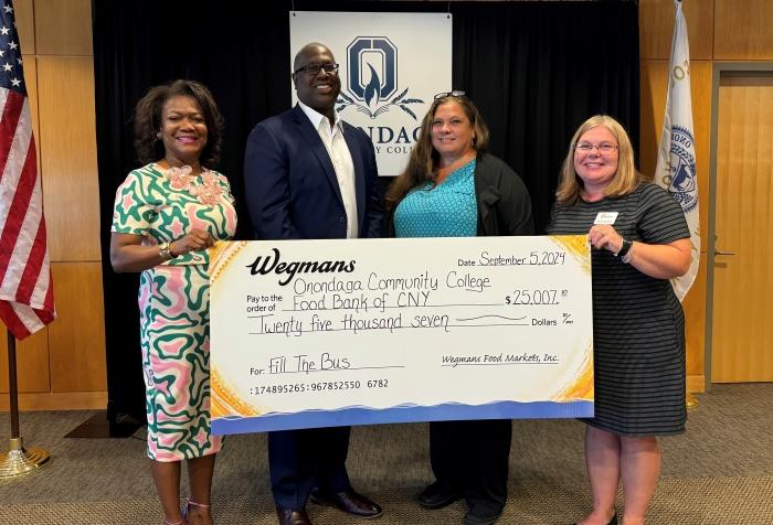 Joining in the check presentation are (left to right) Evelyn Ingram of Wegmans, Warren Hilton and Erika Sheets of OCC, and Karen Belcher of the Food Bank. Joining in the check presentation are (left to right) Evelyn Ingram of Wegmans, Warren Hilton and Erika Sheets of OCC, and Karen Belcher of the Food Bank.