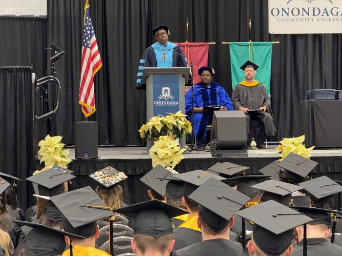 Onondaga Community College President Dr. Warren Hilton speaks to students during commencement December 11 in the SRC Arena. Onondaga Community College President Dr. Warren Hilton speaks to students during commencement December 11 in the SRC Arena.