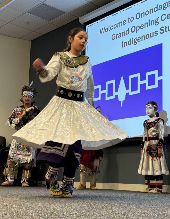 The ceremony celebrating the opening of OCC's new Indigenous Student Center included dancing led by Chris Thomas of the Onondaga Nation's Eel Clan. His daughter is pictured dancing.