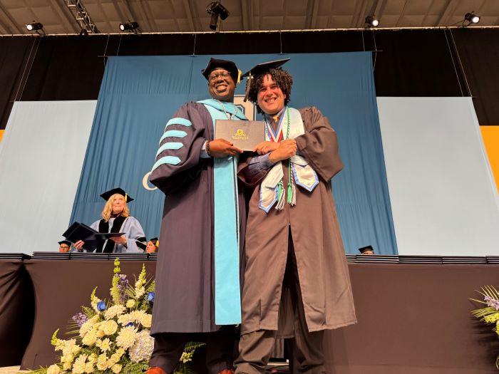 Yesvier Aviles Mendez (right) received his Physical Therapist Assistant degree from OCC President Dr. Warren Hilton (left).