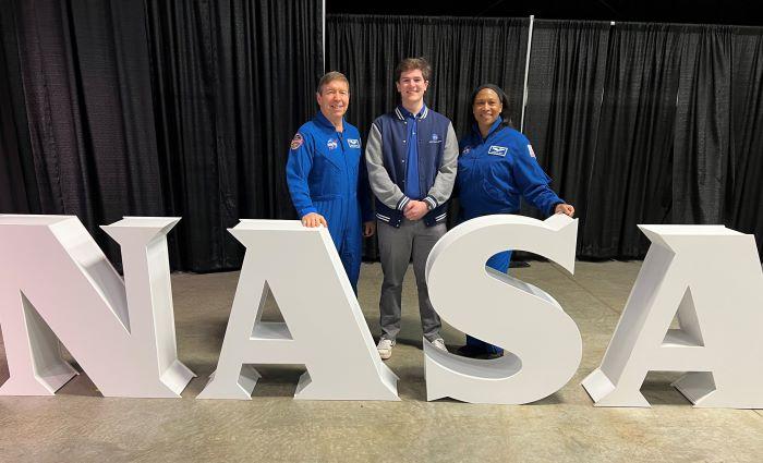 Onondaga Community College Alumnus Isaac Bennett '24 (center) is pictured at NASA with astronauts Dr. Michael Barratt (left) and Jeanette Epps (right) who is a graduate of Syracuse's Corcoran High School.