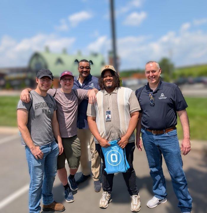 OCC's Director of Central New York Partnerships Dr. Reginald T. Braggs (center) met with OCC students interning at Micron in Virginia (left to right) Logan Peplinski, Nick Hay, Parris Holloman, and Alec Del Gigante. OCC's Director of Central New York Partnerships Dr. Reginald T. Braggs (center) met with OCC students interning at Micron in Virginia (left to right) Logan Peplinski, Nick Hay, Parris Holloman, and Alec Del Gigante.