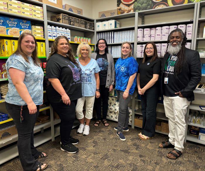 The Counseling and Community Care Hub staff is pictured in the food pantry in the Gordon Student Center. The Counseling and Community Care Hub staff is pictured in the food pantry in the Gordon Student Center.