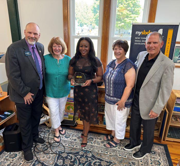 Presenting the Community Impact Business of the Year Award at Birchtree Montessori (left to right): Bob Griffin, SBDC; Karyn Dieffenderfer, Birchtree Montessori; Sonya Smith, SBDC; Rosemary Morgese, Birchtree Montessori; Mark Pitonzo, SBDC. Presenting the Community Impact Business of the Year Award at Birchtree Montessori (left to right): Bob Griffin, SBDC; Karyn Dieffenderfer, Birchtree Montessori; Sonya Smith, SBDC; Rosemary Morgese, Birchtree Montessori; Mark Pitonzo, SBDC.