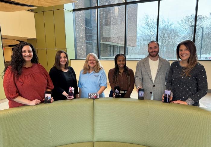 Members of the OCC community showing pictures of their twins are (left to right): Dana Acee, Nicole Schlater, Dana Marzynski, Najier Johnson, David Furney, and Leslie Reid.