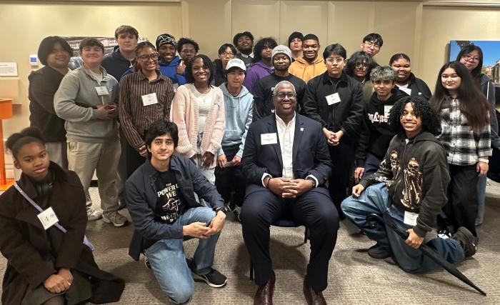 Onondaga Community College President Dr. Warren Hilton (seated) is pictured with students who participated in the first Pre-College Semiconductor Summer Program.