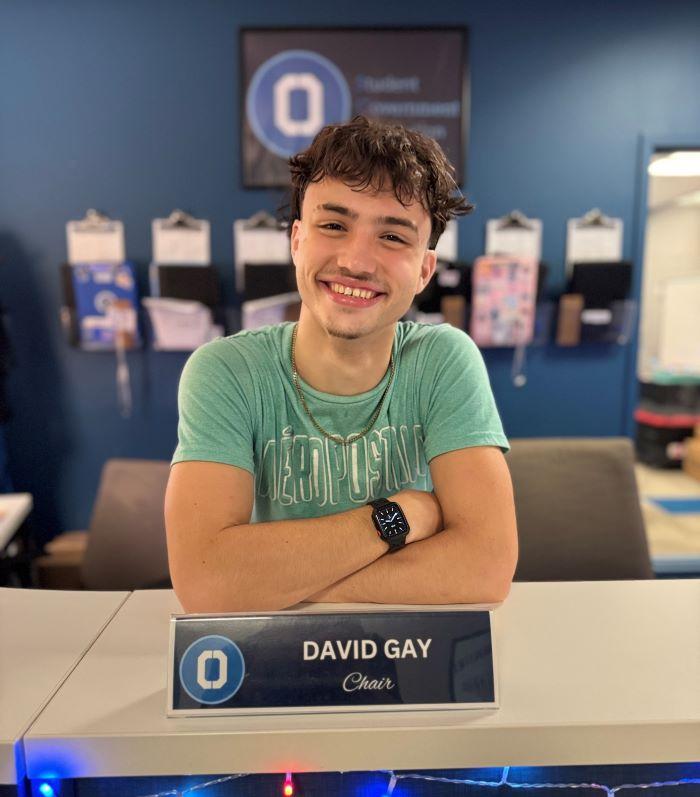 David Gay is a Henninger High School graduate who is majoring in Broadcast Media Communications and is a member of OCC's Men's Track &amp; Field team. He's pictured in OCC's Student Government office where he serves as Chair of Social Media and Marketing.