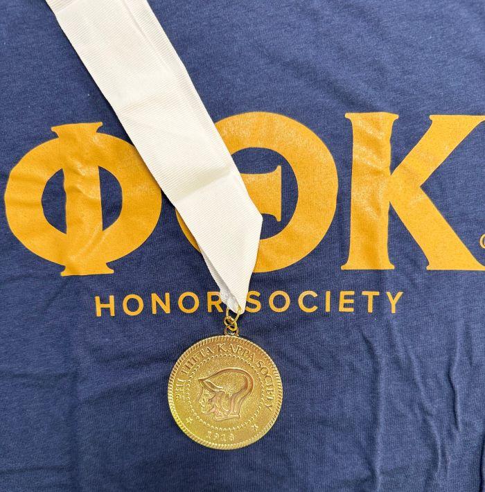 Phi Theta Kappa shirt and medallion