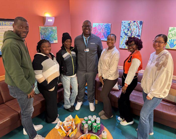 OCC President Dr. Warren Hilton (center) met with SUNY Reconnect students who bring their children to the Children's Learning Center on campus. Pictured (left to right) are Peter Adeyemi, Hawa Giannetto, Marisha Williams, Kahlia Stewart, Shade McKnight, and Mariah Rinaldi.