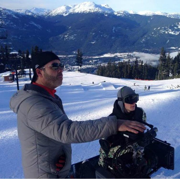 Tony Melfi, '89 (left) in scenic Whistler, British Columbia, Canada shooting an X Games feature in January 2015. With him is two-time gold medalist snowboarder Max Parrot planning his next trick.